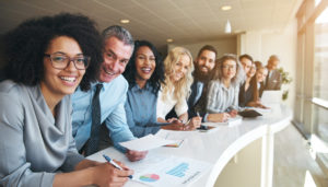 employees standing in front of window